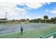 Well-maintained community pickleball court near a pond at 660 Linden Dr, Englewood, FL 34223