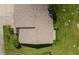 Top-down view of a home's roof and surrounding landscaping at 660 Linden Dr, Englewood, FL 34223