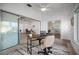 Sunroom features a desk, seating area, and access to the backyard at 660 Linden Dr, Englewood, FL 34223