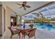 Inviting pool area with patio furniture and screened enclosure at 67 Pine Valley Ct, Rotonda West, FL 33947