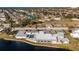 Community clubhouse with pool and shuffleboard courts at 672 Circlewood Dr # V9, Venice, FL 34293