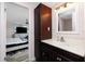 Bathroom with dark vanity, single sink, and shower/tub combo at 672 Circlewood Dr # V9, Venice, FL 34293