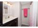 Clean bathroom with dark vanity, shower, and updated fixtures at 672 Circlewood Dr # V9, Venice, FL 34293