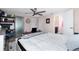 Comfortable bedroom with king-size bed and access to additional storage at 672 Circlewood Dr # V9, Venice, FL 34293