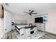 Spacious bedroom with king-size bed, ceiling fan, and lots of natural light at 672 Circlewood Dr # V9, Venice, FL 34293