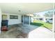 Covered carport with storage and view of neighboring houses at 672 Circlewood Dr # V9, Venice, FL 34293