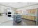 Well-equipped community kitchen with stainless steel appliances at 672 Circlewood Dr # V9, Venice, FL 34293