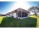 Rear exterior view showing the screened porch at 672 Circlewood Dr # V9, Venice, FL 34293