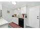 Modern kitchen with white cabinets and granite counters at 672 Circlewood Dr # V9, Venice, FL 34293
