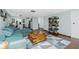 Open living room with sectional sofa and kitchen view at 672 Circlewood Dr # V9, Venice, FL 34293