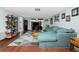 Spacious living room with sectional sofa and wood floors at 672 Circlewood Dr # V9, Venice, FL 34293