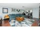 Open living room with sectional sofa and kitchen view at 672 Circlewood Dr # V9, Venice, FL 34293