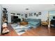 Spacious living room with sectional sofa and wood floors at 672 Circlewood Dr # V9, Venice, FL 34293