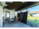 Screened porch with ceiling fan and patio furniture at 672 Circlewood Dr # V9, Venice, FL 34293