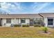 View of home's back and nicely landscaped yard at 6796 Gasparilla Pines Blvd # 89, Englewood, FL 34224