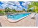 Inviting community pool with ample seating at 6796 Gasparilla Pines Blvd # 89, Englewood, FL 34224