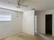 Bedroom with window, ceiling fan and access to bathroom at 7140 Teaberry St, Englewood, FL 34224