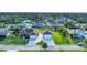 Aerial view of two houses with a large yard and double garages at 7257 Bridgeport Ln, Englewood, FL 34224