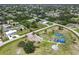 Arial view of neighborhood park with playground, basketball court, and open space at 7257 Bridgeport Ln, Englewood, FL 34224