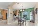 Dining room with a table for four and a view of the kitchen at 7257 Bridgeport Ln, Englewood, FL 34224