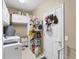 Bright laundry room with washer, dryer, and ample storage at 7257 Bridgeport Ln, Englewood, FL 34224