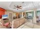 Open-concept living room, dining, and kitchen area with tile floors at 7257 Bridgeport Ln, Englewood, FL 34224