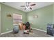 Home office with wood flooring and built in shelving at 7257 Bridgeport Ln, Englewood, FL 34224