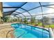 Resort-style pool with spa and covered patio at 7257 Bridgeport Ln, Englewood, FL 34224