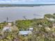 Aerial showcasing waterfront home and private dock access at 7475 Manasota Key Rd, Englewood, FL 34223