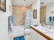 Bathroom with tub, shower, and updated vanity at 7475 Manasota Key Rd, Englewood, FL 34223