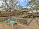 Elevated deck with seating, offering scenic views at 7475 Manasota Key Rd, Englewood, FL 34223