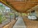Elevated home with deck, stairs, and ample parking area at 7475 Manasota Key Rd, Englewood, FL 34223