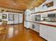 Bright kitchen features wood floors and stainless steel appliances at 7475 Manasota Key Rd, Englewood, FL 34223