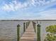 Long private dock extending into calm waters at 7475 Manasota Key Rd, Englewood, FL 34223