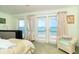 Bedroom with stunning ocean views and access to balcony at 7630 Manasota Key Rd, Englewood, FL 34223