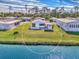 Aerial view showing a single-Gathering home on a canal at 812 Seabrooke Dr, Englewood, FL 34223
