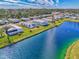 Waterfront community view from above, showcasing homes and landscaping at 812 Seabrooke Dr, Englewood, FL 34223