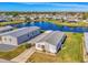 Mobile home with carport, situated by a lake at 812 Seabrooke Dr, Englewood, FL 34223