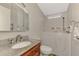 Bathroom boasts walk-in tub,granite countertop, and vanity at 812 Seabrooke Dr, Englewood, FL 34223