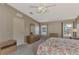 Bedroom with a floral comforter and dresser at 812 Seabrooke Dr, Englewood, FL 34223