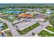 Community clubhouse with tennis courts, pool, and shuffleboard at 812 Seabrooke Dr, Englewood, FL 34223