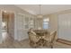 Cozy dining area with built-in hutch and glass-top table at 812 Seabrooke Dr, Englewood, FL 34223