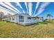 Exterior view of the property showcasing landscaping at 812 Seabrooke Dr, Englewood, FL 34223