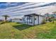 Single-wide home with carport and well-manicured lawn at 812 Seabrooke Dr, Englewood, FL 34223