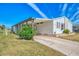 Single-story home with carport and landscaping at 812 Seabrooke Dr, Englewood, FL 34223