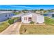Single-story home with carport and landscaped lawn at 812 Seabrooke Dr, Englewood, FL 34223