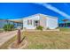 Single-story home with carport, brick accents at 812 Seabrooke Dr, Englewood, FL 34223