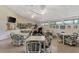 Community game room with tables, chairs, and a TV at 812 Seabrooke Dr, Englewood, FL 34223