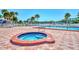 Community hot tub and surrounding patio area at 812 Seabrooke Dr, Englewood, FL 34223