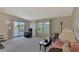 Relaxing living room with water view, comfy seating, and ample natural light at 812 Seabrooke Dr, Englewood, FL 34223